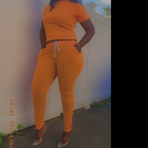 Women's 2-piece short sleeved high-waisted track suit w/ zippered leg- Orange